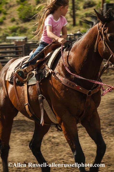 Young Cowgirl Rides Horse At Gardiner Montana Rodeo Allen Russell