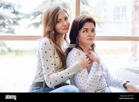 Beautiful Woman And Daughter Confident Successful Woman Posing With Daughter In Interior Design