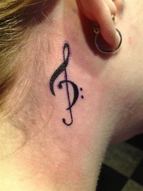 Music tattoos are also a way of showing one's love for music. treble clef tattoo, neck, ear, design | Favimages.net | Treble clef tattoo, Music tattoos, Music ...