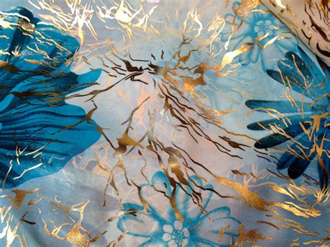 Maybe you would like to learn more about one of these? Blue floral fabric with gold overlay from the textile souk ...