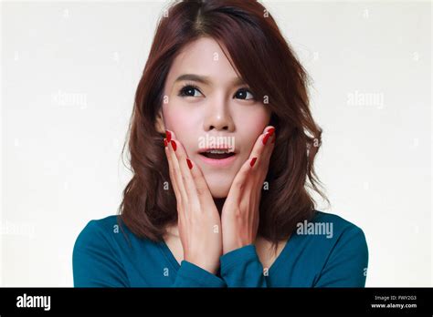 Young Woman Is Holding Her Face In Astonishment Stock Photo Alamy