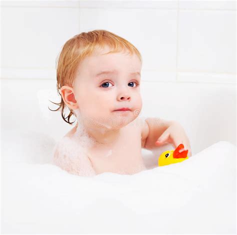 Ducklings also grow incredibly fast. Baby taking a bath stock photo. Image of play, child ...