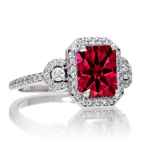 Three stone diamond rings celebrate the past, the present and what's to come in your amazing love story. 1.5 Carat Emerald Cut Three Stone Ruby Halo Diamond Ring on 10k White Gold - JeenJewels