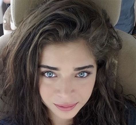 Beautiful Woman With Blue Eyes In A Car