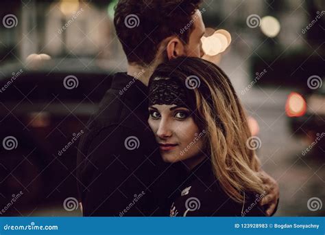 stylish gypsy couple in love hugging in evening city street at m stock image image of night