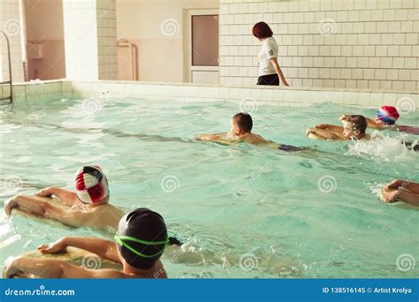Elementary School Children Within Swimming Skills Lesson Editorial