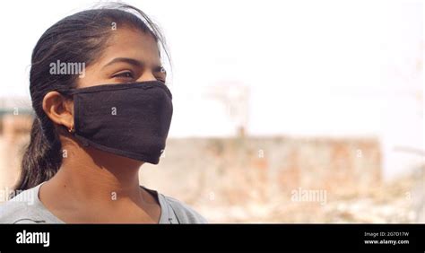Closeup Shot Of An Indian Girl Wearing A Mask New Normal Concept Stock