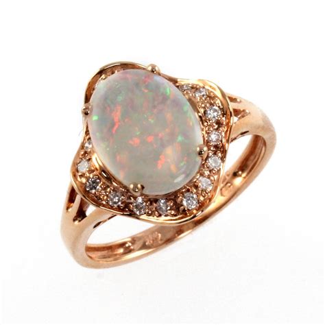 14 karat yellow gold weight: 14ct rose gold opal & diamond ring. - Jewellery from Mr Harold and Son UK