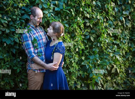 Young Happy Couple Hugging Outdoors Among The Greenery Stock Photo Alamy