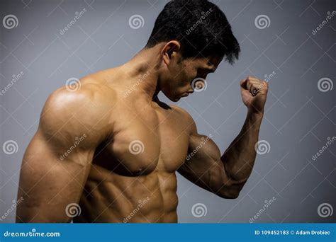 Fitness Model Flexing Bicep Muscle Stock Image Image Of Body Muscles