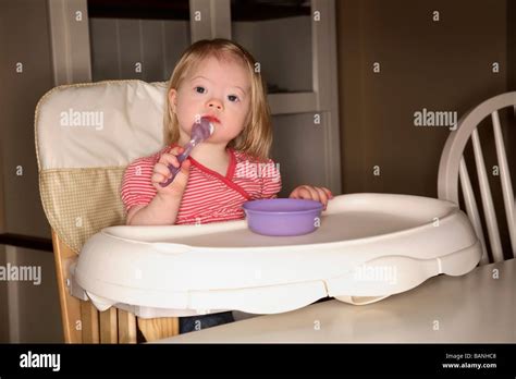 Girl In A High Chair Stock Photo Alamy