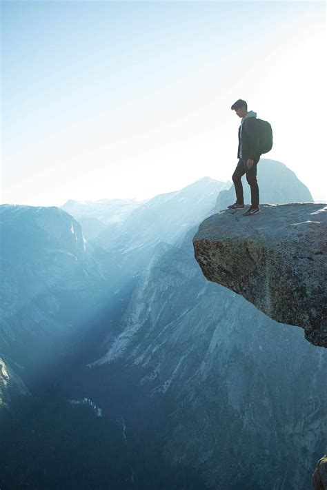 Hd Wallpaper Man Standing On Cliff Person Standing On The Top Edge Of Mountain Cliff