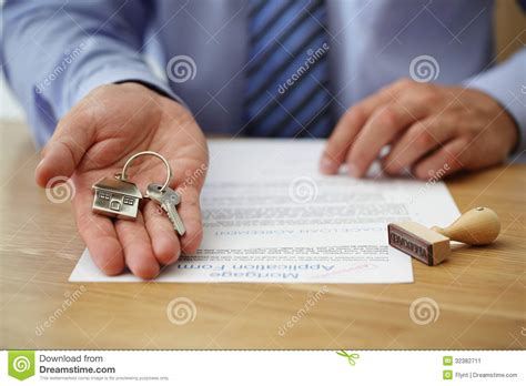 Should companies make open systems that, on the surface, appear less profitable but put power in the hands of the consumer? Handing Over House Keys Stock Image - Image: 32382711