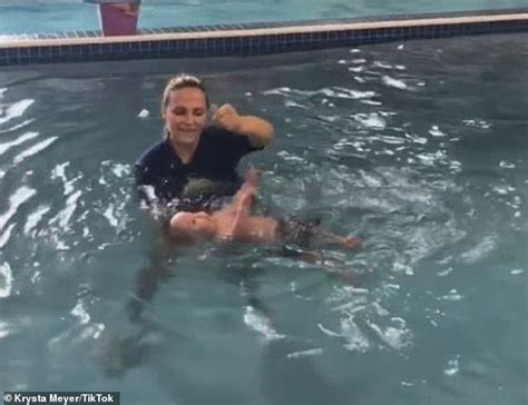 Video Of Baby Being Thrown In Swimming Pool Sparks Controversy Daily Mail Online