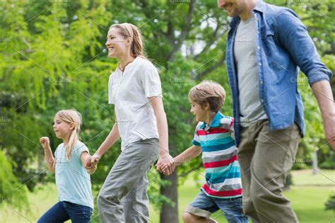 Parents And Kids Walking In Park High Quality Stock Photos ~ Creative
