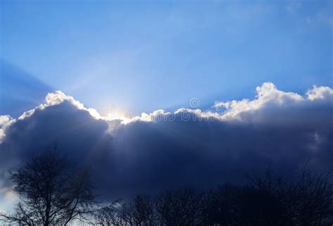 Beautiful Sunlight Beams Through A Stunning Cloudscape In The Sky Stock