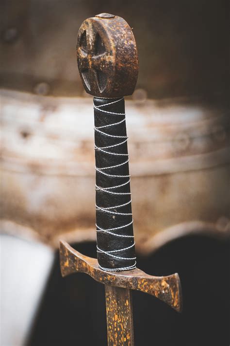 Closeup Photo Of Black Hilt And Brown Sword · Free Stock Photo
