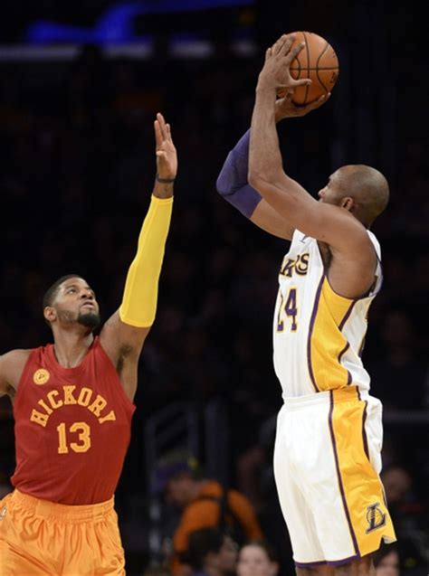 Indiana pacers' paul george (24) points skyward after scoring against the utah jazz in the fourth quarter during an nba basketball. Paul George: Indiana Pacers, NBA's Effortless Superstar