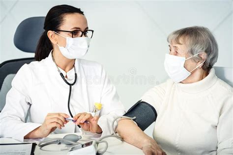 Healthcare In Hospital Concept Female Doctor Consulting Old Lady Stock