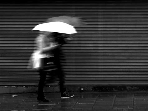 street shadow rain umbrella couple standing shutters light blackandwhite girl bw