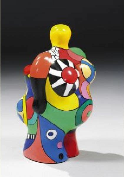 A Multicolored Ceramic Vase With A Clown Figure On It S Head And Eyes