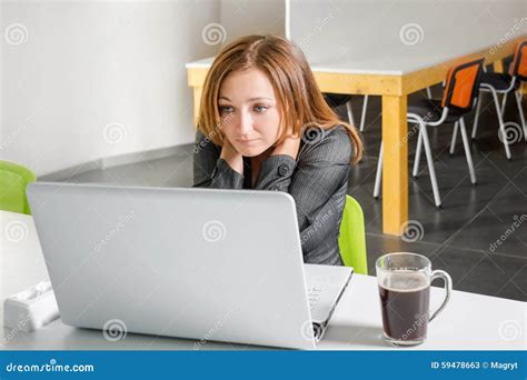 Depressed Businesswoman Sitting At Computer Tired And Sleepy Office