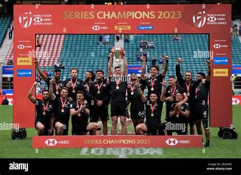 New Zealand S Sam Dickson Lifts The Hsbc World Series Trophy With His