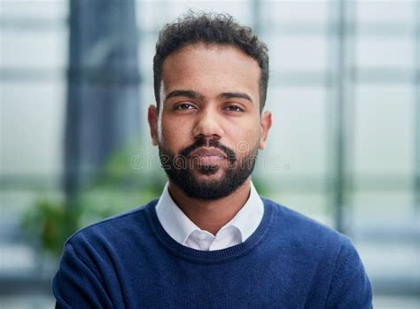 Smiling Millennial Confident Black Guy Posing For Photo Looking At