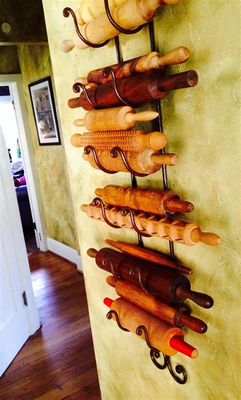 Must Have In My Home Someday Vintage Rolling Pins On A Wine Rack