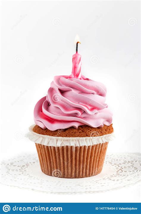 Tasty Pink Cupcake With Candle For Happy Birthday On Light Background