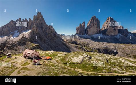 Stunning Panorama Of Tre Cime And Dreizinnen Hut Dolomites Stock Photo