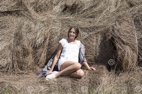 Young Beautiful Woman In The Hayloft In The Village Stock Photo Image