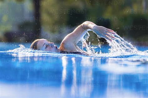 Beautiful Woman Swimming In Swimming Pool Stock Photo