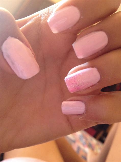 Baby Pink Nail Polish With Glitter On One Nail