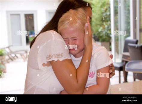Mother Comforting Crying Child Stock Photo Alamy