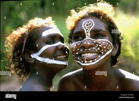 Aboriginal Sisters Tessa And Jane Enjoy Painting Their Faces With Stock