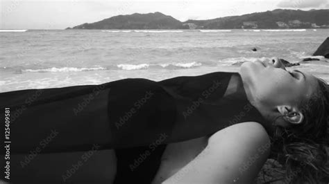 Vidéo Stock Sensual Woman Lying At The Sandy Beach Black See Through