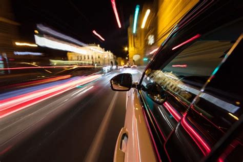 Speeding Car Driving In A Night City Tario And Associates Ps