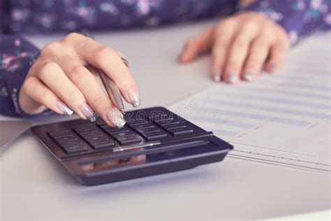 Close Up Of Female Accountant Or Banker Hand Making Calculations Savings Finances And Economy