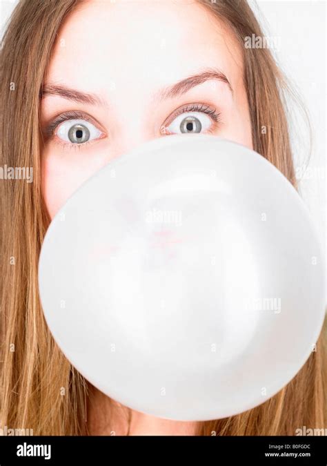 Woman Blowing Up A Bubble Gum Stock Photo Alamy