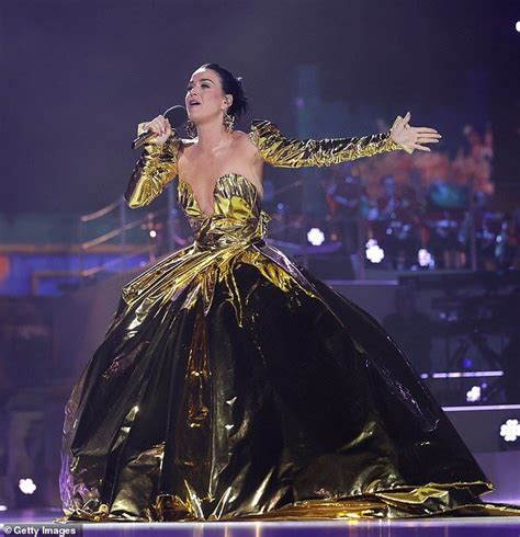 Katy Perry Stars In A Huge Gold Metallic Dress As She Takes The Stage
