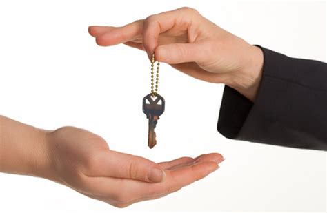 Handing over the keys with a sold real estate sign in the background. Landlord Tenant Disputes | Business Law | Dorne Law Craig ...
