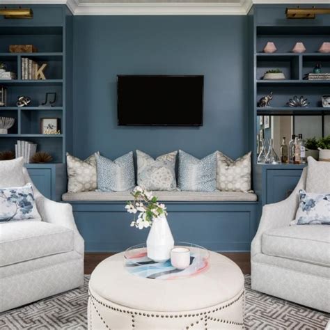 Dusty Blue Living Room Features Brass Chandelier And Coffee Table Hgtv