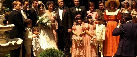 Adults, including a fairy godmother, drink beer and a lemon drop shot at a bar. The Godfather Movie Review & Film Summary (1972) | Roger Ebert