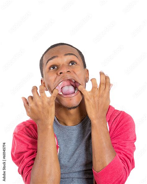 Crazy Deranged Looking Young Man Having A Panic Attack Stock Photo