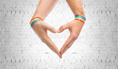 Male Hands With Gay Pride Wristbands Showing Heart Stock Image Image Of Liberty Love 150241011