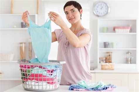 Place your faded clothes into your washing machine, add laundry detergent, and turn on the machine. Washing New Clothes | ThriftyFun