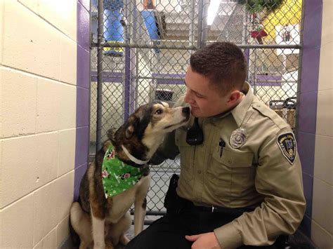 This dog says goodbye to the Animal Control Officer that saved him
