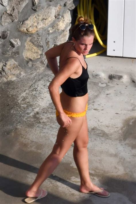 Emma Watson Spotted In A Black Crop Top And Yellow Bikini Bottoms While