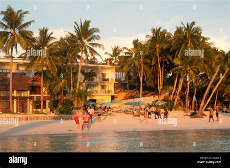 Boracay Beach Philippines Hotel And People On White Beach At Sunset